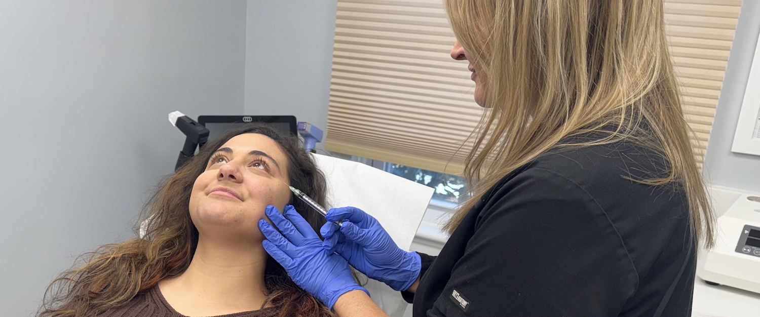 Clean, professional medical spa treatment room with neutral tones at Lasemedica Medspa and Vein Center in Morristown